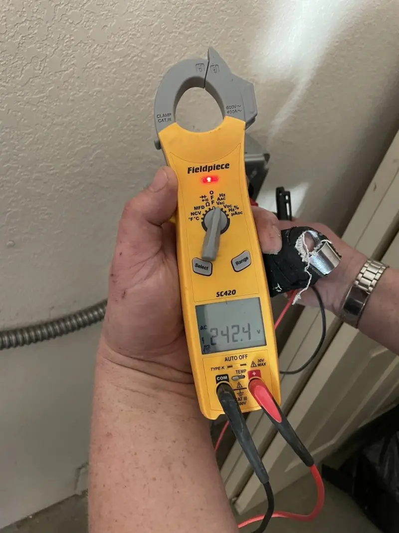 Voltage testing with clamp meter during Ceiling Fan Installation in Vineyard